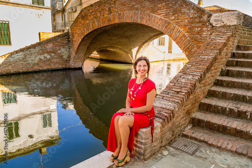 Classy woman sitting on bridge © Vivida Photo PC