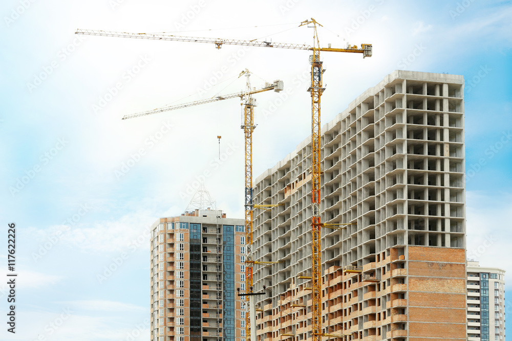 Crane and building construction on sky background Crane and building construction on sky background