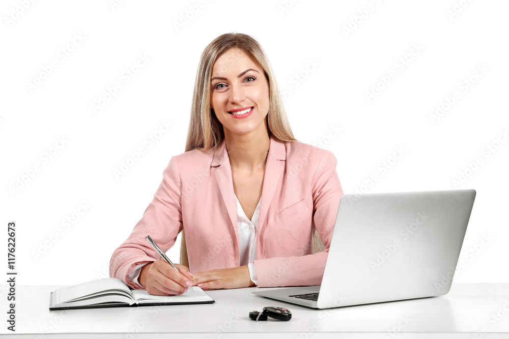 Seller woman at table with laptop and car key isolated on white Seller woman at table with laptop and car key isolated on white