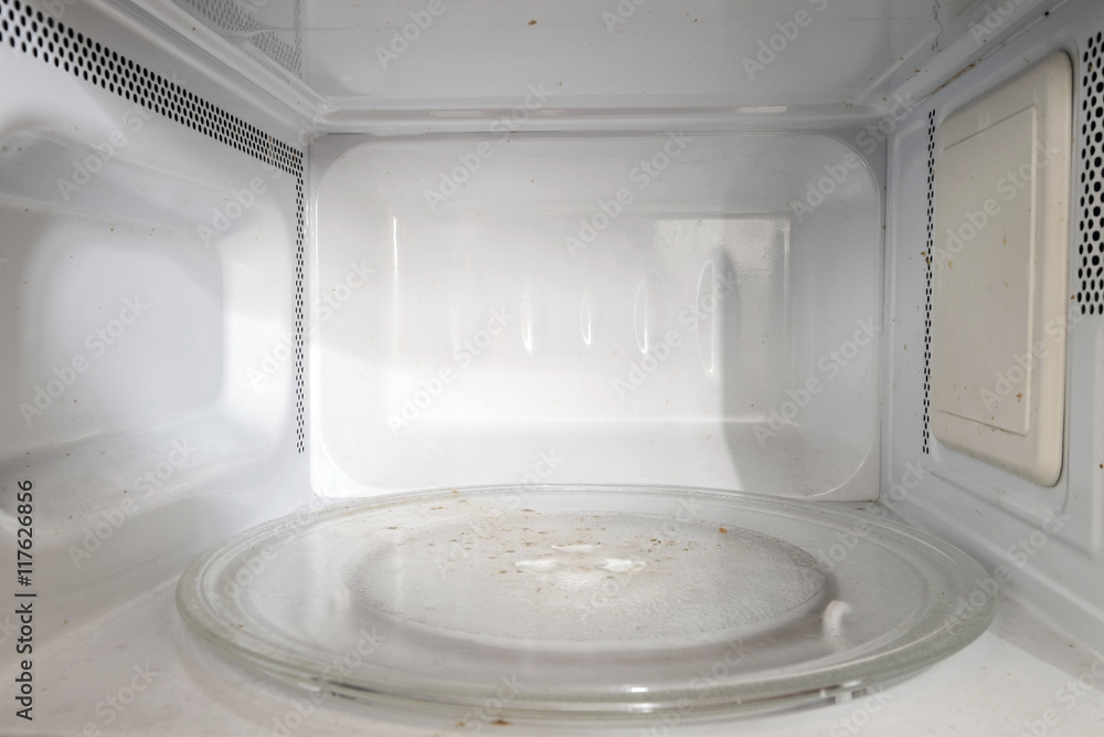 Dirty microwave oven, inside oven Dirty microwave oven, inside oven