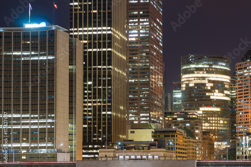 Modern cityscape at night background. Office skyscrapers of Sydney downtown at dusk. Copy space, long exposure