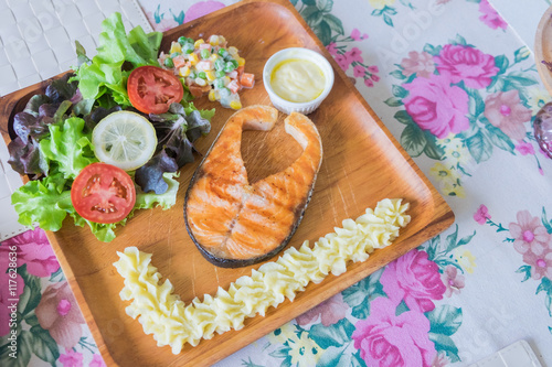 Grilled Salmon steak with salad.