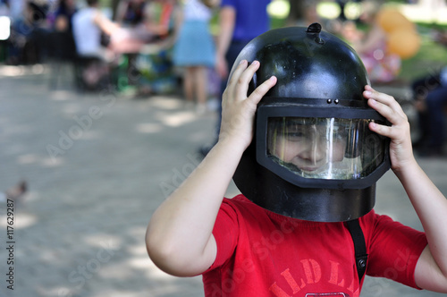 Boy in a police helmet