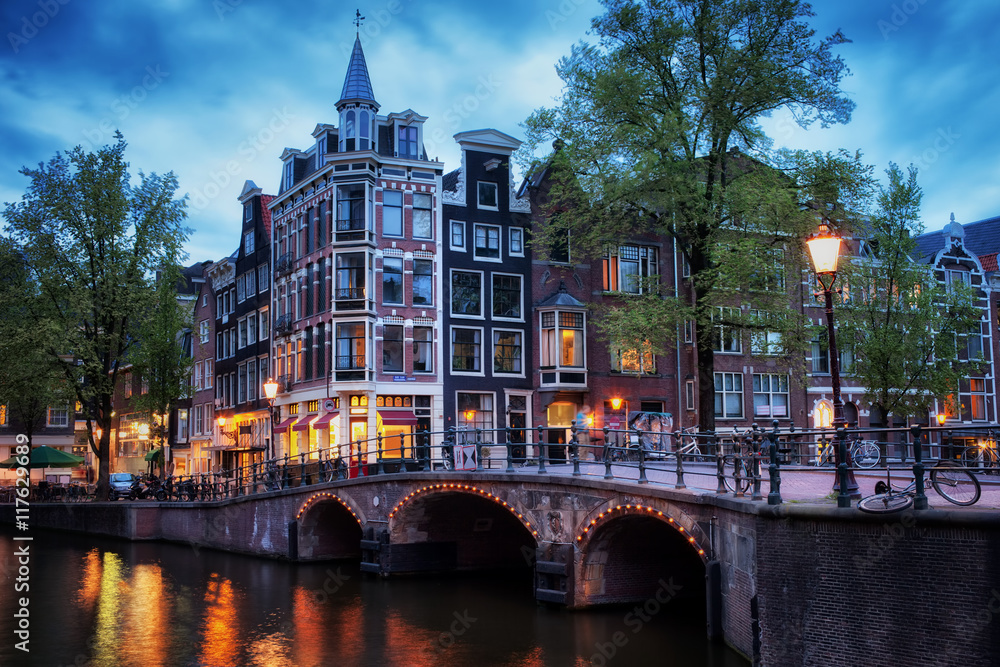 Naklejka premium City of Amsterdam at twilight in Holland, Netherlands