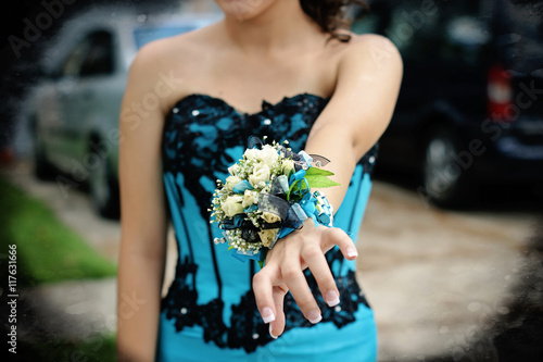 Pretty turquoise and black wrist corsage worn to the prom. Fototapet