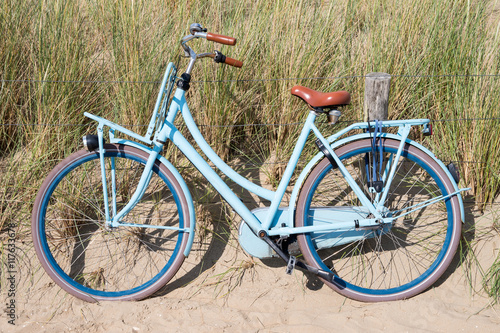 blue bike parked in the dunes at the Dutch North Sea coast