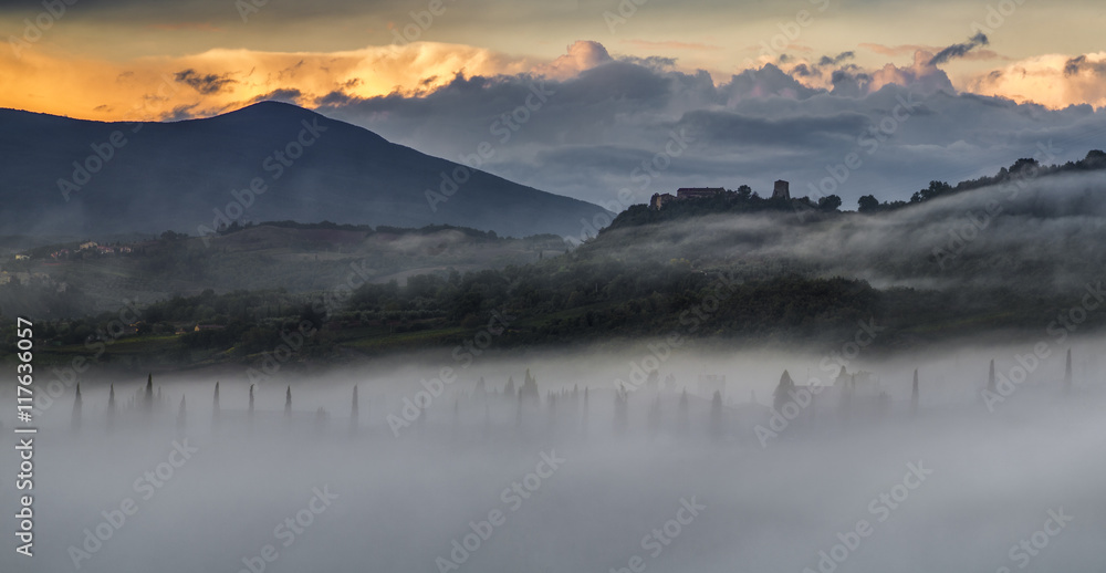 The morning Tuscan landscape, fog in the valleys
