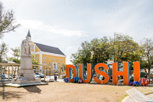 Dushi by Statue and Church photo