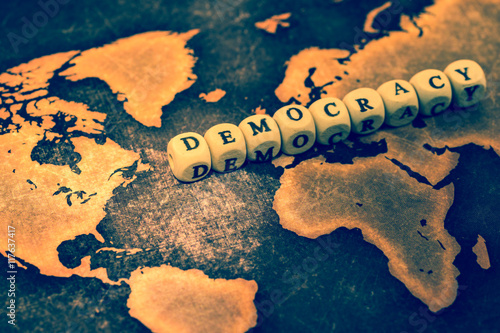 Fototapeta DEMOCRACY on grunge world map