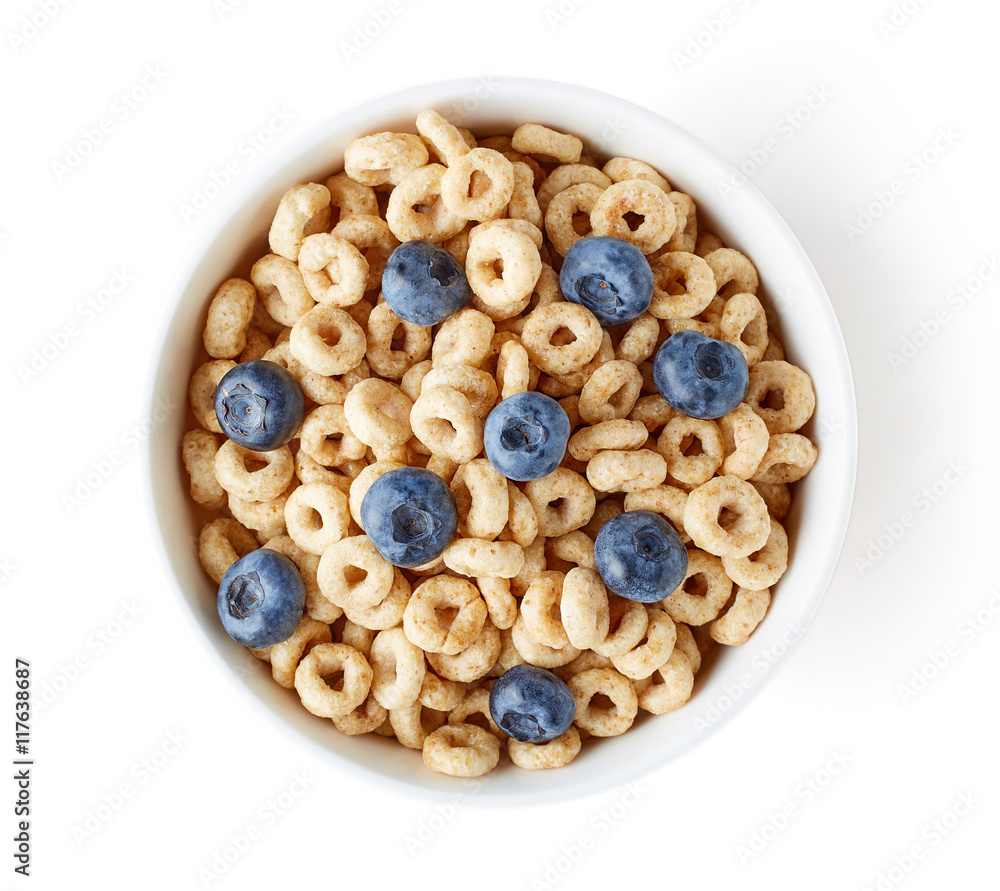 Bowl of whole grain cheerios cereal with blueberries isolated on Bowl of whole grain cheerios cereal with blueberries isolated on