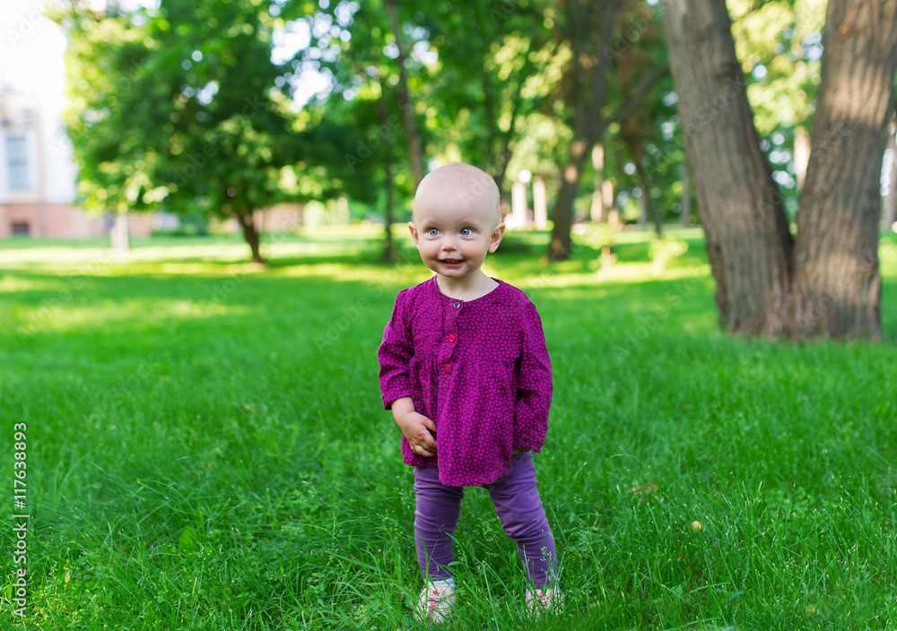 Cute little girl on the meadow in summer day Cute little girl on the meadow in summer day