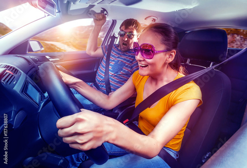Fotografie Couple travelling by car