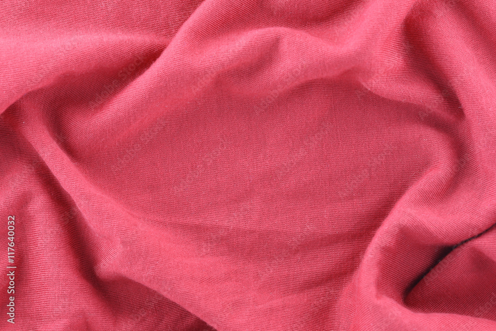 Closeup of rippled red cotton fabric. Closeup of rippled red cotton fabric.