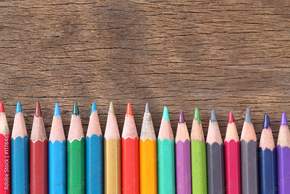 Closeup Color pencils concatenation on old wooden background. Closeup Color pencils concatenation on old wooden background.