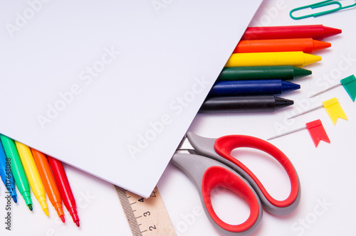Color pencils and watercolors on white background  back to school  stationery with empty space