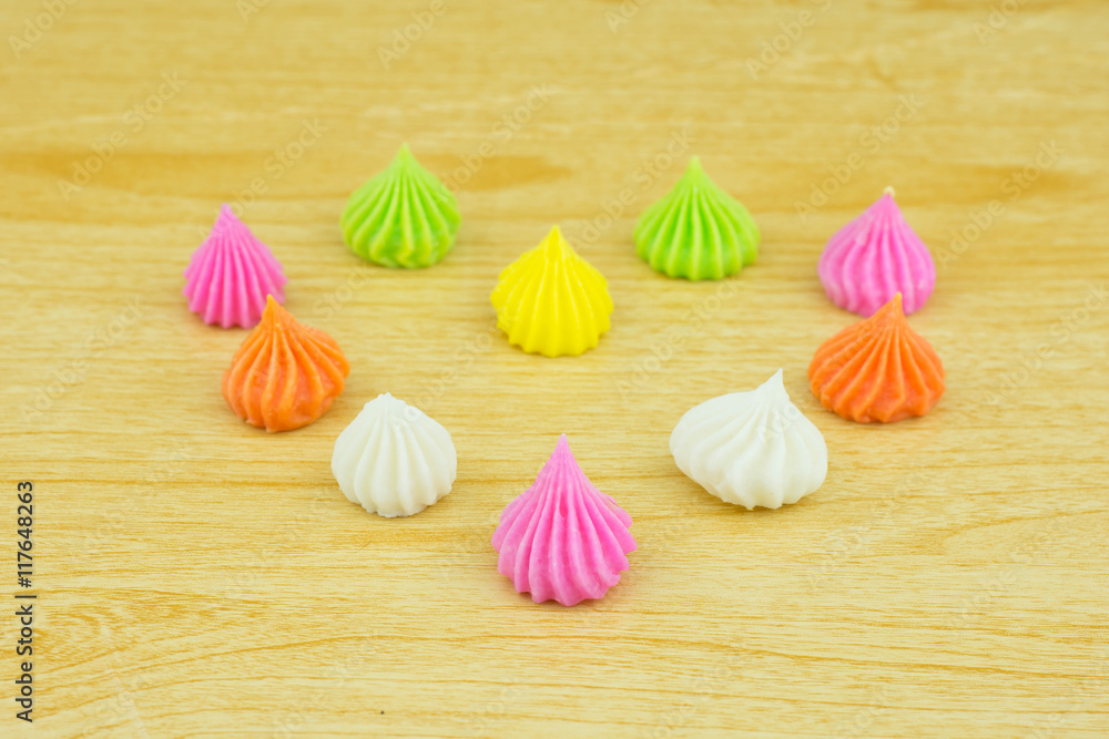 Aalaw candy, colorful Thai dessert on wood background Aalaw candy, colorful Thai dessert on wood background