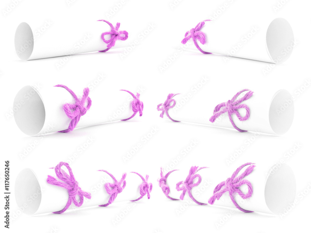 White paper rolls tied with pink ropes and knots collection White paper rolls tied with pink ropes and knots collection