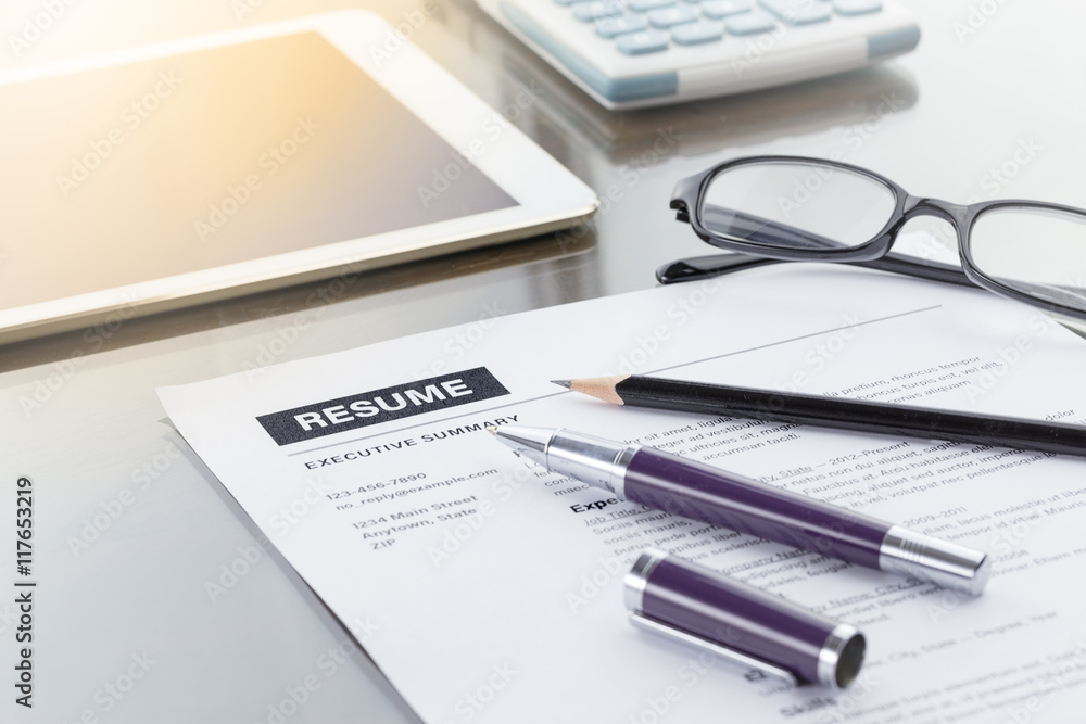 Resume information with pen, pencil and glasses. Warm tone Resume information with pen, pencil and glasses. Warm tone