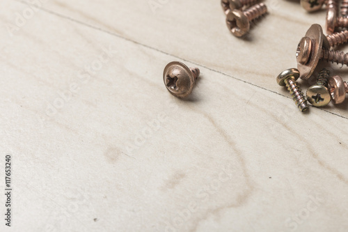 Wallpaper Mural Metal tiny screws on a wooden table with screwdriver Torontodigital.ca