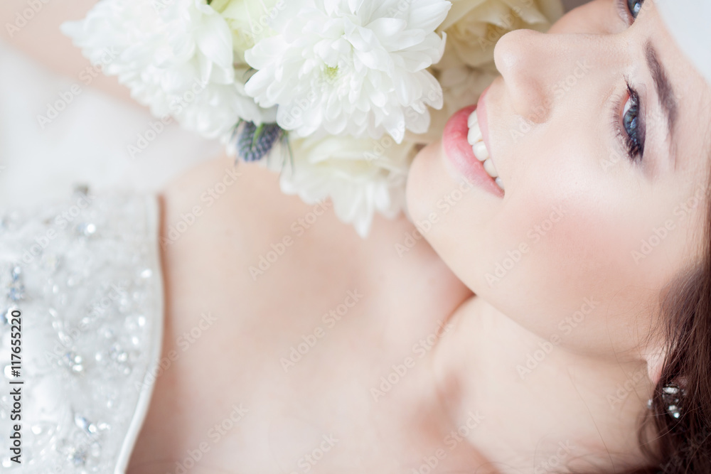 Happy bride laughing, girl with a bouquet of flowers. Wedding decoration Happy bride laughing, girl with a bouquet of flowers. Wedding decoration