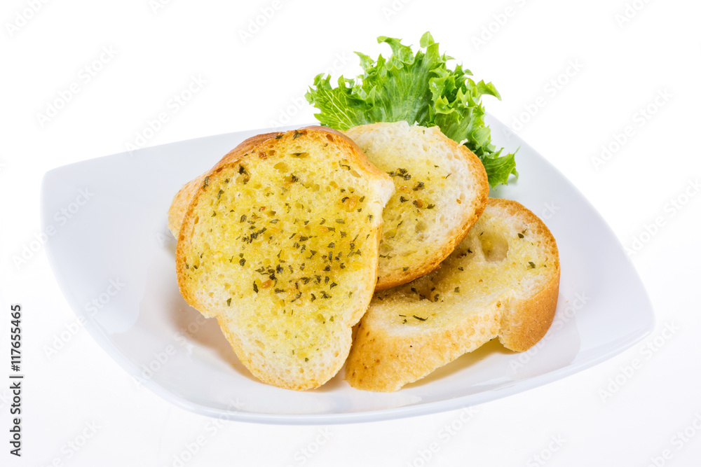 Garlic bread on white plate