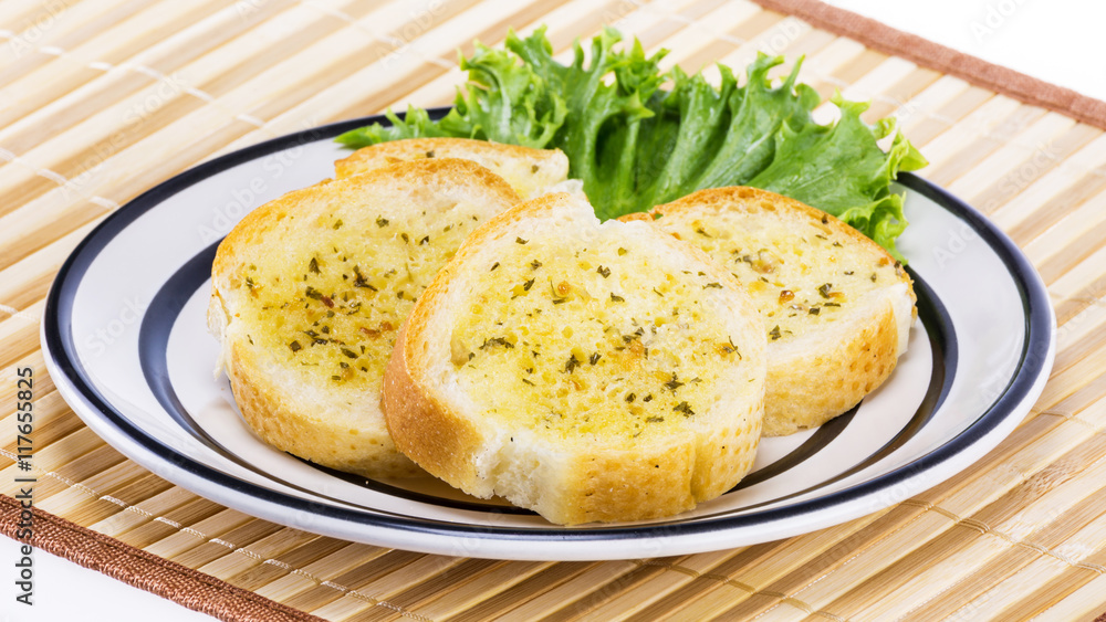 Garlic bread on white plate Garlic bread on white plate