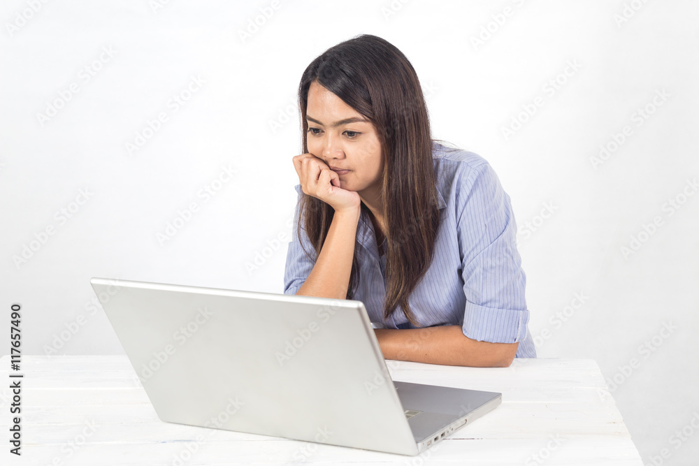 Young business asian woman working by using notebook in office Young business asian woman working by using notebook in office