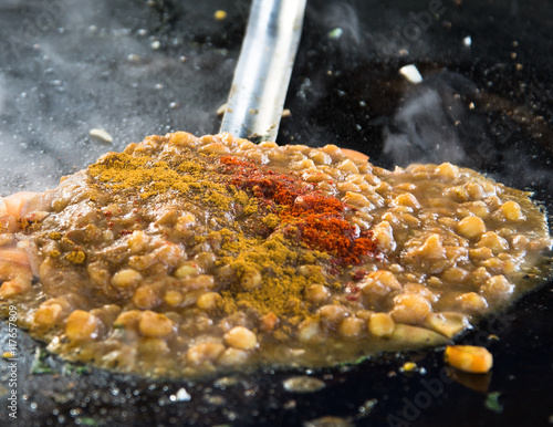 Street cooking of Chole. Chole or Chickpea curry cooking. A very popular Indian food photo