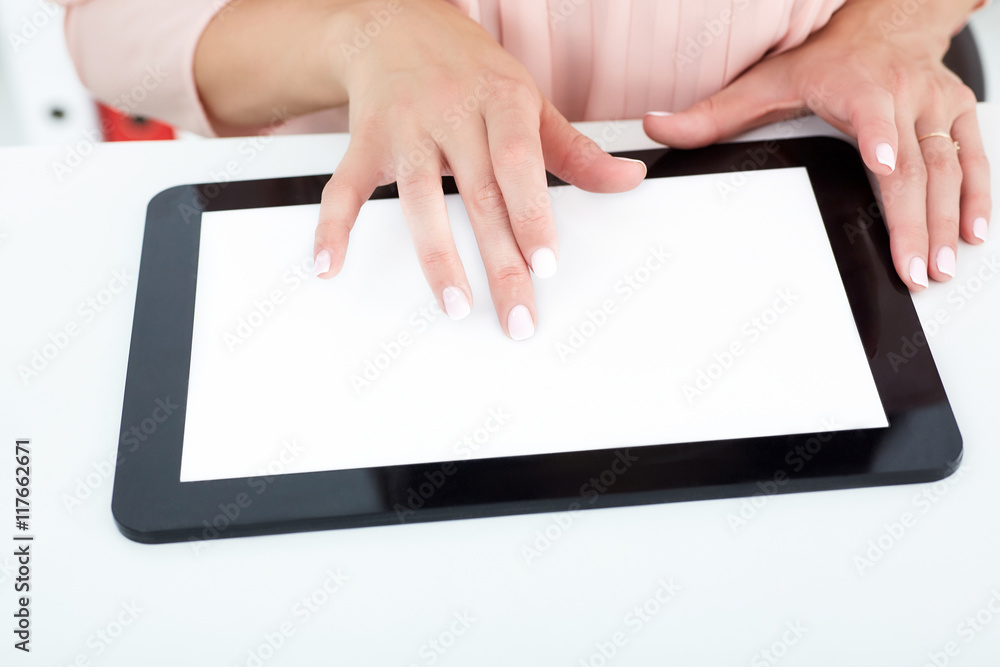 Female hands working on the tablet closeup. Female hands working on the tablet closeup.