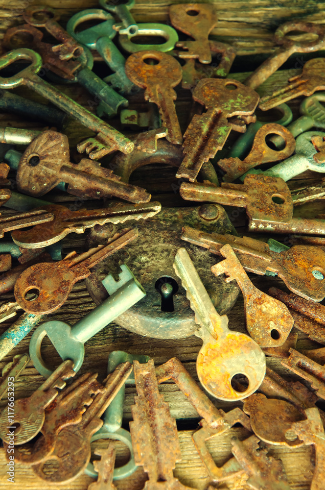 Old rusty padlock and keys on wooden background Old rusty padlock and keys on wooden background