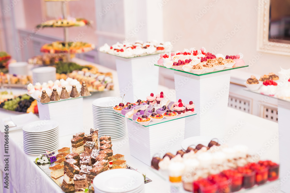 Naklejka premium Delicious wedding reception candy bar dessert table