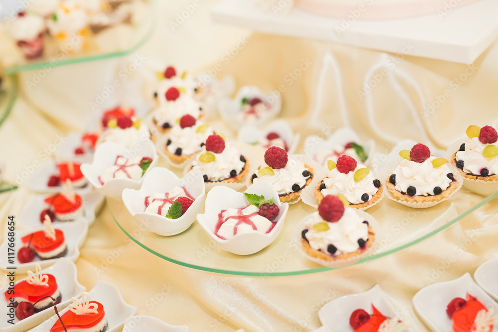 Naklejka premium Delicious wedding reception candy bar dessert table