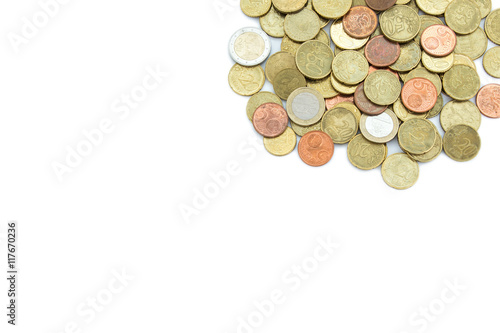 Heap of different Euro coins isolated on white background, viewed from above. Copy space.