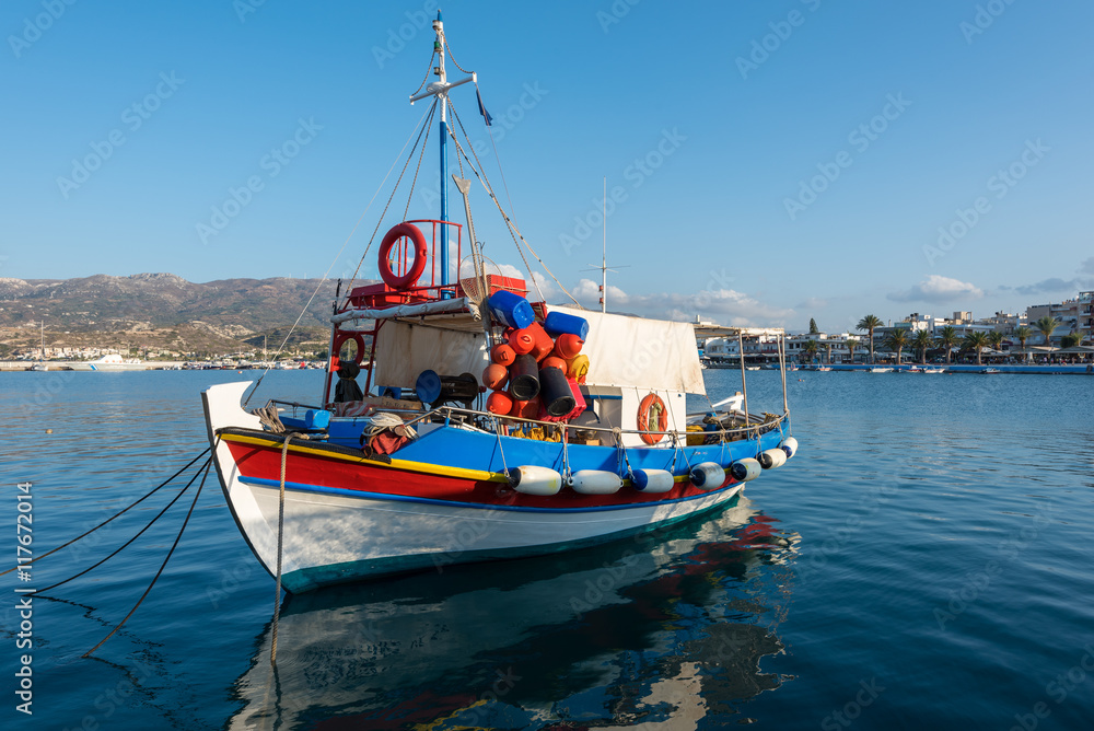 raditional Greek wooden fishing boat at port of Sitia town in eastern part of Crete island