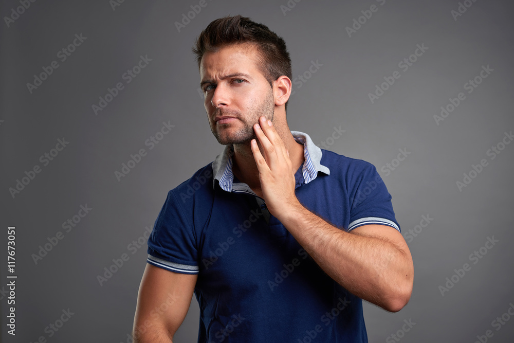 Young man checking his skin Young man checking his skin