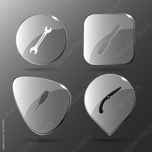 4 images: spanner, chisel, awl, hand saw. Angularly set. Glass b