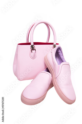 Pair of pink women's shoes with handbag isolated on a white © yuliachupina