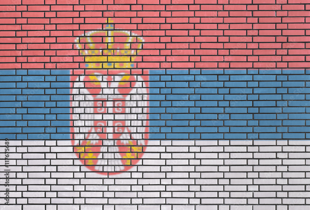 Serbian flag painted on brick wall