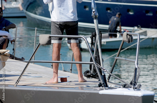 Worker barefoot on boat