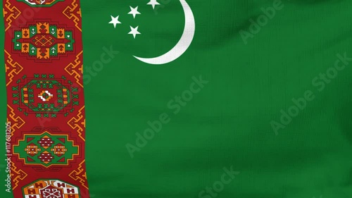 National flag of Turkmenistan flying and waving on the wind. Sate symbol of Turkmen nation and government. Computer generated animation. photo