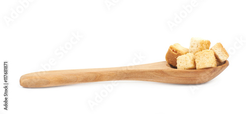 Spoon full of croutons isolated