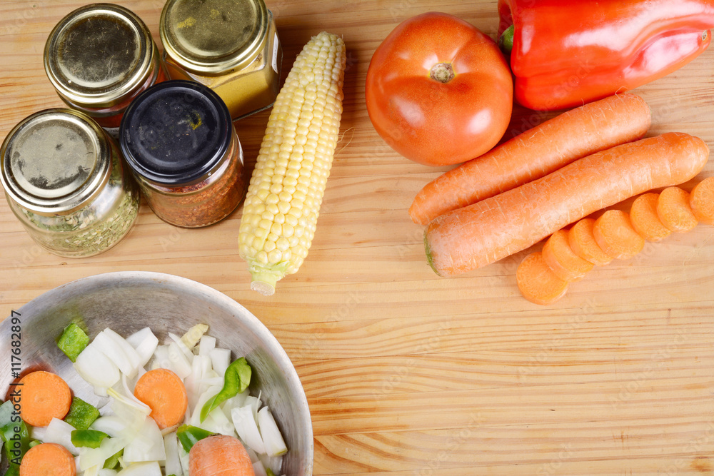Vegetables and seasonings on wooden table. Vegetables and seasonings on wooden table.