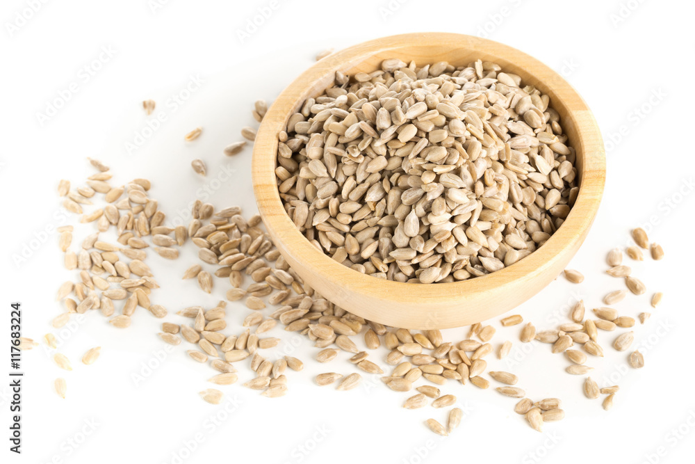 Shelled sunflower seeds in wooden bowl Shelled sunflower seeds in wooden bowl