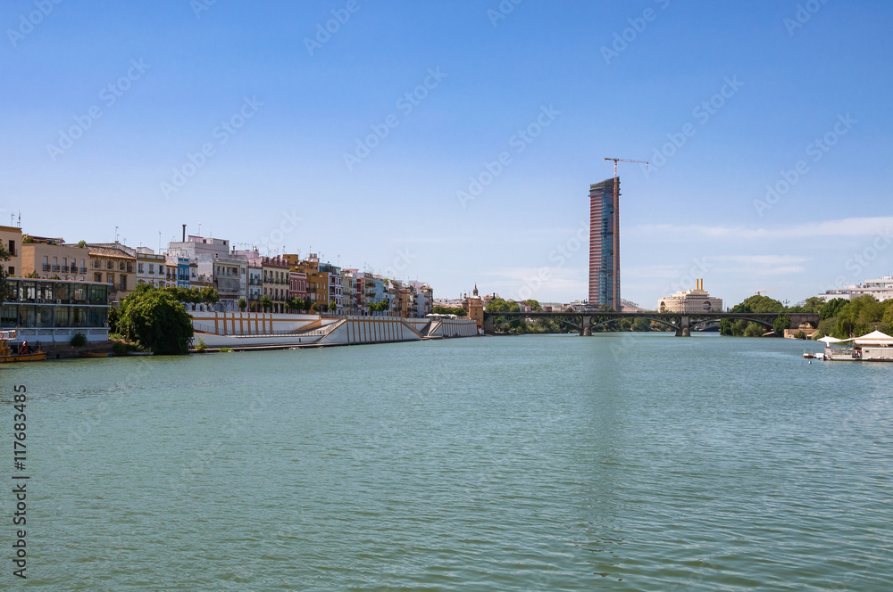 View of Guadalquivir River and Triana Bridge in Seville View of Guadalquivir River and Triana Bridge in Seville