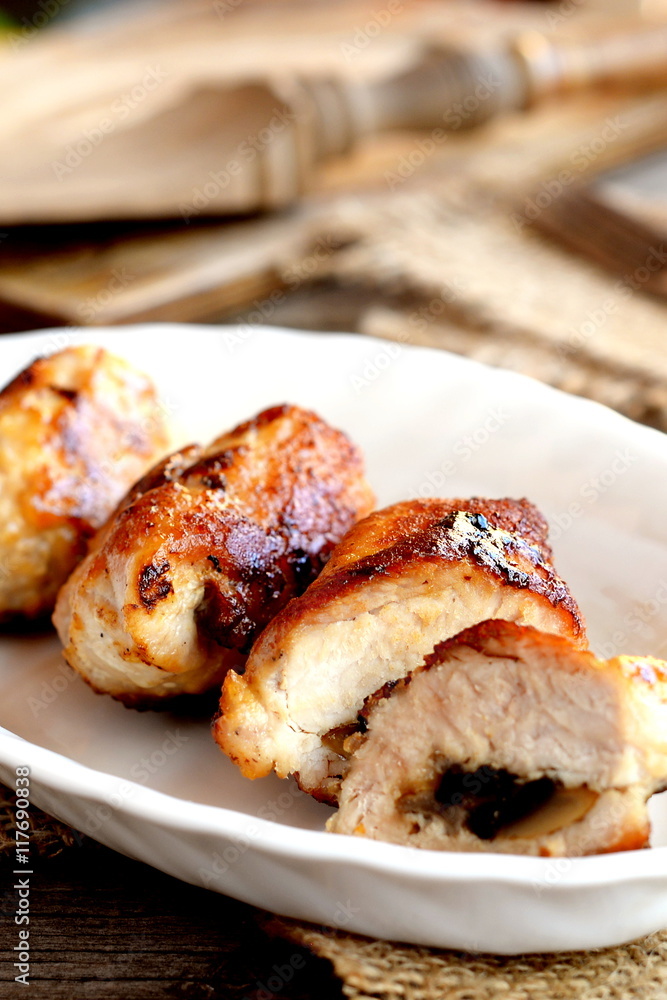 Delicious fried Turkey meat rolls on a plate. Fork, cuisine board on old wooden table. Roasted Turkey breast rolls stuffed with cheese and agaricus. Festive food recipe. Rustic style. Vertical photo Delicious fried Turkey meat rolls on a plate. Fork, cuisine board on old wooden table. Roasted Turkey breast rolls stuffed with cheese and agaricus. Festive food recipe. Rustic style. Vertical photo