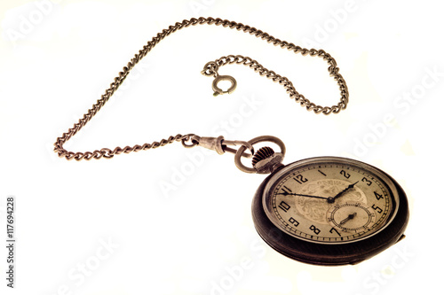 Vintage antique pocket watch with chain.