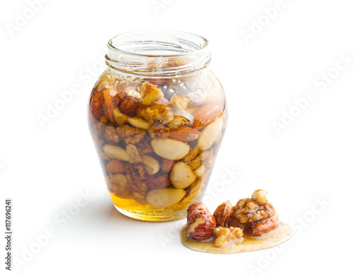Honey and nuts in jar.