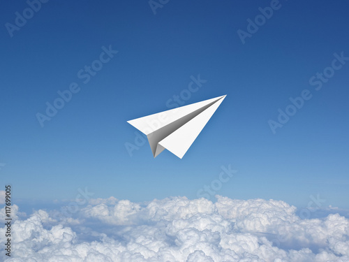 Paper plane in the blue sky above clouds 3D rendering