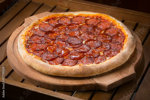 hot fresh pizza on a wooden table