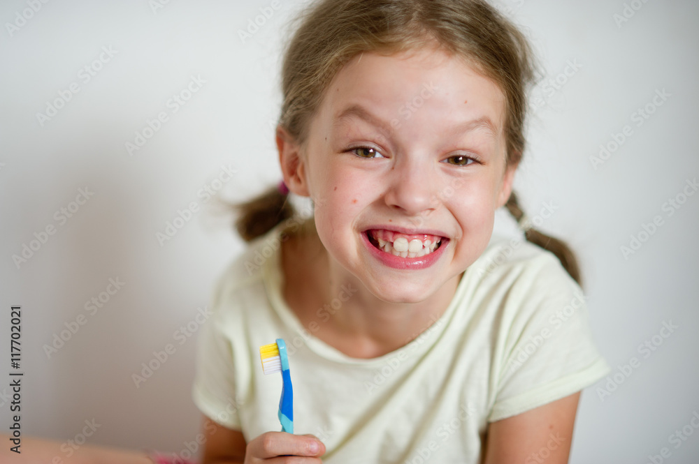 Funny girlie with pigtails brushing his teeth. Funny girlie with pigtails brushing his teeth.
